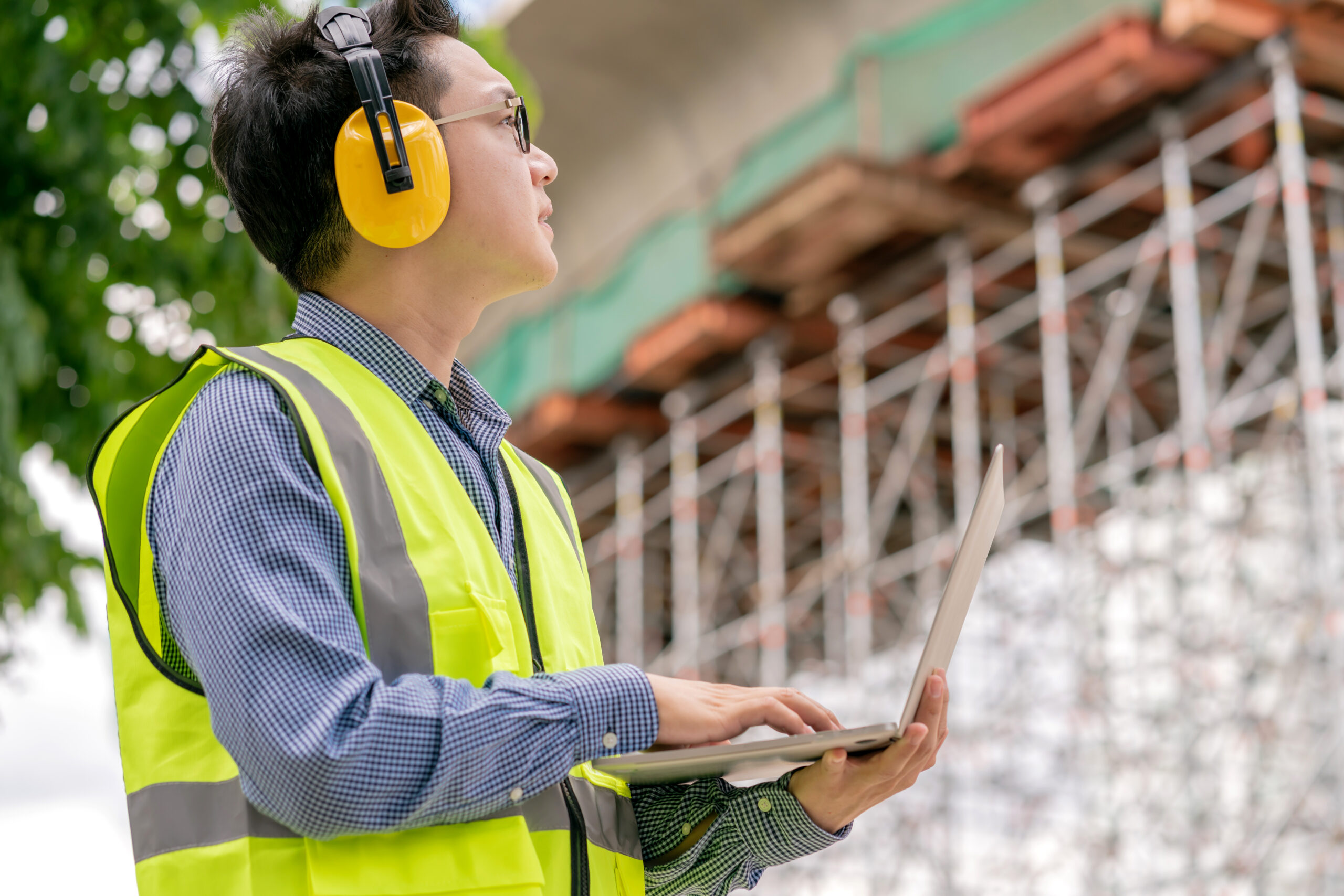 Dahtec Sdn. Bhd. engineer using radio connection working on construction site