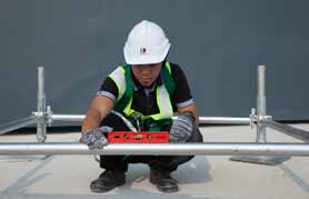 Clamp the first horizontal member. Insert and lock the first lift of triangle.